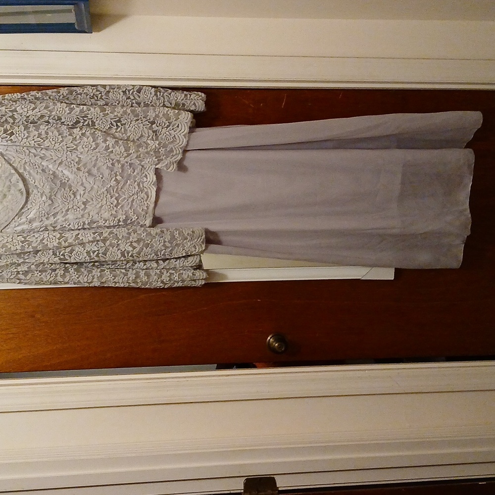 Silver jacket dress with lace bodice and straps.